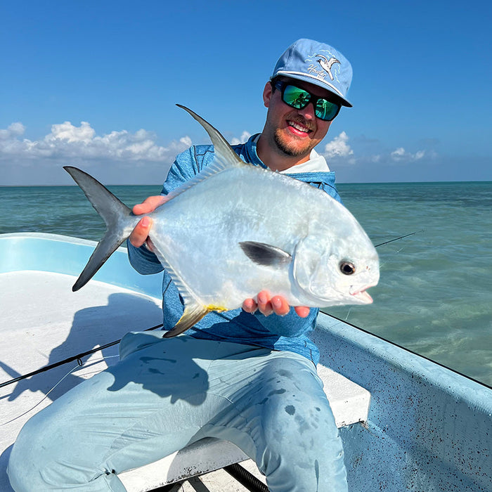 Xavier hold a permit fish