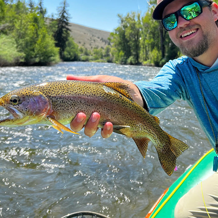 Xavier holding a Rainbow Trout